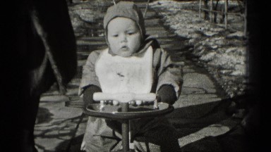 1947: babies first bike ride down snowy winter sidewalk street MIDDLETOWN