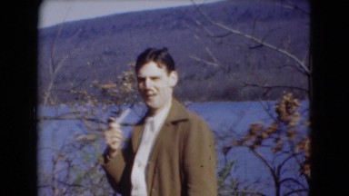 1947: charming man smoking pipe on the bank of river MIDDLETOWN