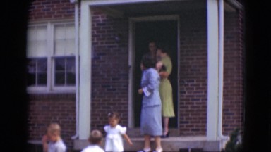 1947: large family leaving for special social gathering on lazy afternoon.