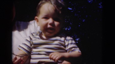 1947: mother holding baby baby in warm summer sunshine MIDDLETOWN