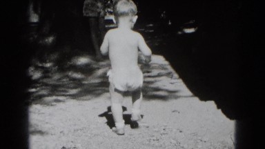 1947: Baby Boy Exploring Outdoor Area in White Diapers Middletown