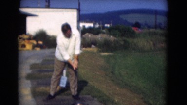1947: man is seen beside garden playing MIDDLETOWN