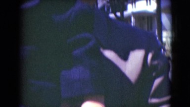 1947: father holding child as he is speaking into the camera MIDDLETOWN