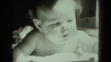 1947: baby playing with toys MIDDLETOWN