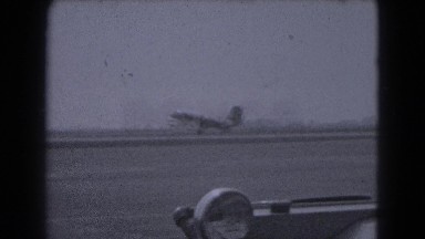 1947: airplane taking off followed by little boy running MIDDLETOWN