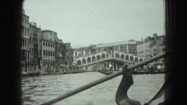 1949: Man in Venice Rows Boat Through Water