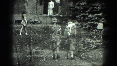 1949: Two Girls Walking, Jumping, and Playing in Venice, Italy