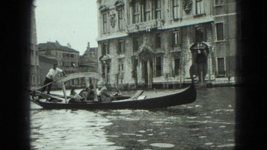 1949: People Enjoying Gondola Ride Through Scenic Historic City Venice, Italy