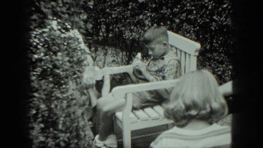 1949: children sitting outdoors in lounge chairs eating ice cream VENICE, ITALY