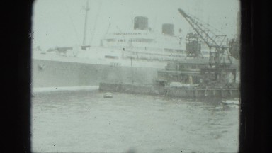 1949: ships in harbor and boats sailing past VENICE, ITALY