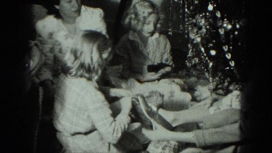 1949: caucasian family ravenously opening xmas gifts VENICE, ITALY