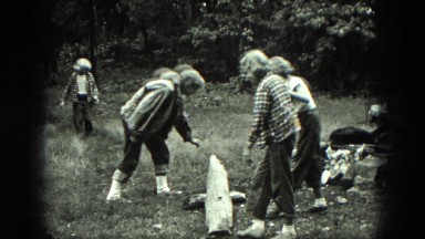 1949: three girls attempting see saw and falling off onto the ground VENICE