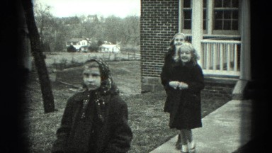 1949: three cheerful girls departing on trip one girl sticks her tongue out at