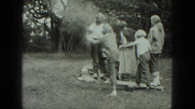 1949: four children play on homemade teeter totter