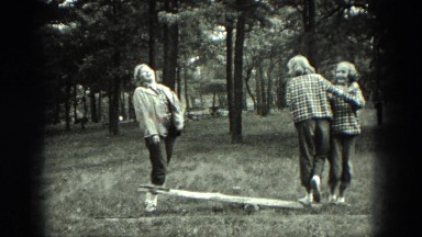 1949: girls out in the woods playing on teeter totter VENICE, ITALY
