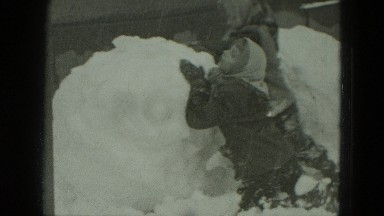 1951: kids are making huge snowman GERMANY