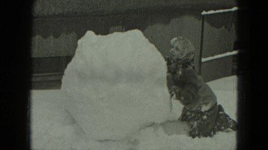 1951: girls are making huge snowman GERMANY