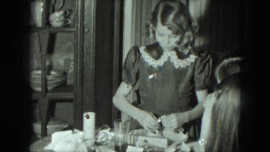 1951: Young Girl Opens Present, Reveals Shiny Bracelet in Austria