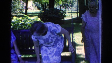 1966: woman moves over to make room for third lady on front porch swing