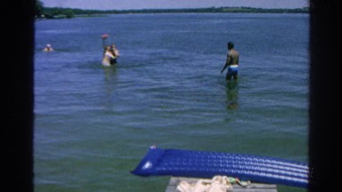 1966: lake summer fun throwing ball in water dad on dock pier CALIFORNIA
