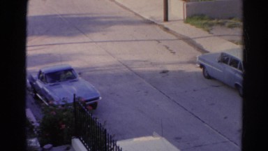 1966: classic blue corvette stingray car driving out from above viewpoint