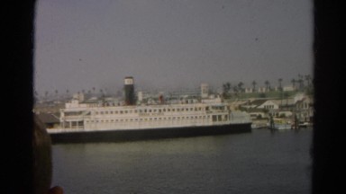 1966: Very Large Docked White Ship with Several Windows in California