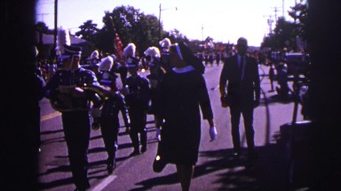 1973: people marching in parade with nun walking along them LYNBROOK, NEW YORK