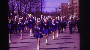 1974: group of girls performing great act in spectacle on the street LYNBROOK