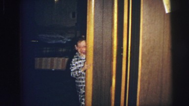 1974: excited children christmas morning coming out to get gifts LYNBROOK
