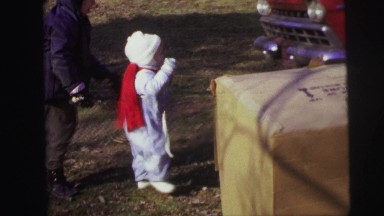 1974: two kids approaching red color car remains parked LYNBROOK, NEW YORK