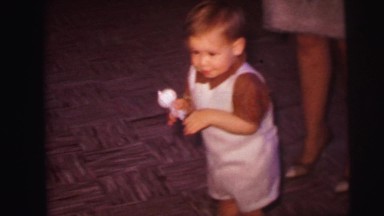 1974: mother with small child is seen LYNBROOK, NEW YORK