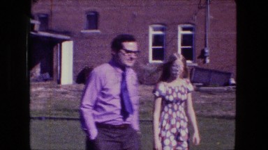 1976: Handsome Man and Beautiful Woman Strolling in Meadow Fort Wayne