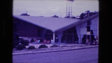1976: girls in bikinis walking in doors from hotel pool FORT WAYNE, INDIANA