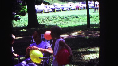 1971: kids playing with balloons at family summer reunion OMAHA, NEBRASKA