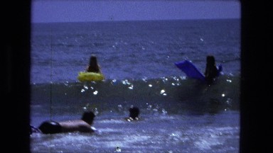 1976: people playing in the water on plastic floatation devices. FORT WAYNE