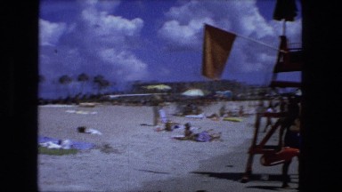 1976: the perfect beach scene from palm laden streets to soft white sands