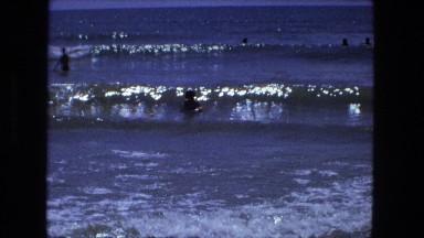 1976: perfect beach scene people having hot summer fun on the sandy area