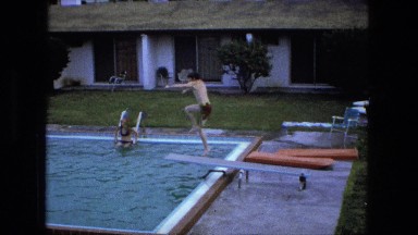 1976: boy jumping doing flip off of swimming pool diving board FORT WAYNE