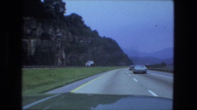 1976: big rock roadcut along new interstate highway, driving