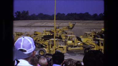 1976: Crowd Watching Construction Equipment Demonstration