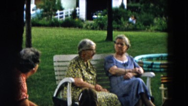 1957: three women talk as they sit in chairs at gathering in yard HICKSVILLE
