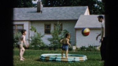 1957: father is seen playing with children HICKSVILLE, NEW YORK