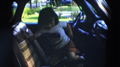 1957: little girl in the front seat of car pretending to drive HICKSVILLE