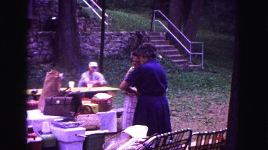 1971: two woman outdoors preparing family picnic OMAHA, NEBRASKA