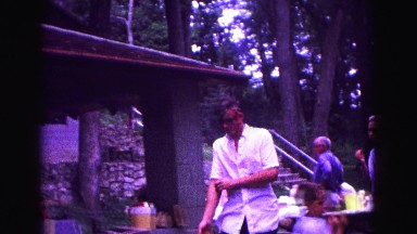 1971: family reunion man walking rolling up shirt sleeves OMAHA, NEBRASKA