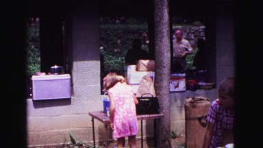 1971: child getting camera for her mother OMAHA, NEBRASKA