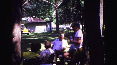 1971: old people socializing outdoors at family reunion celebration OMAHA