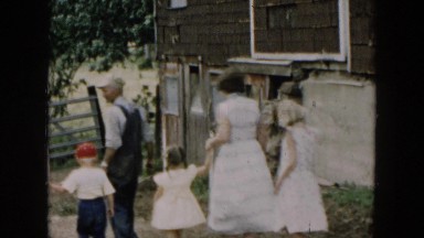 1957: Man Leading Group Down Path Into Old Building Hicksville, New York