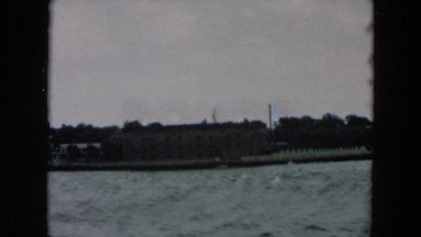 1957: Boat View of Shoreline with Two Buildings, Hicksville, New York