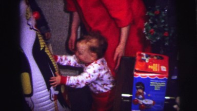 1973: Child in Pajamas Playing with Inflatable Toy Lynbrook, New York